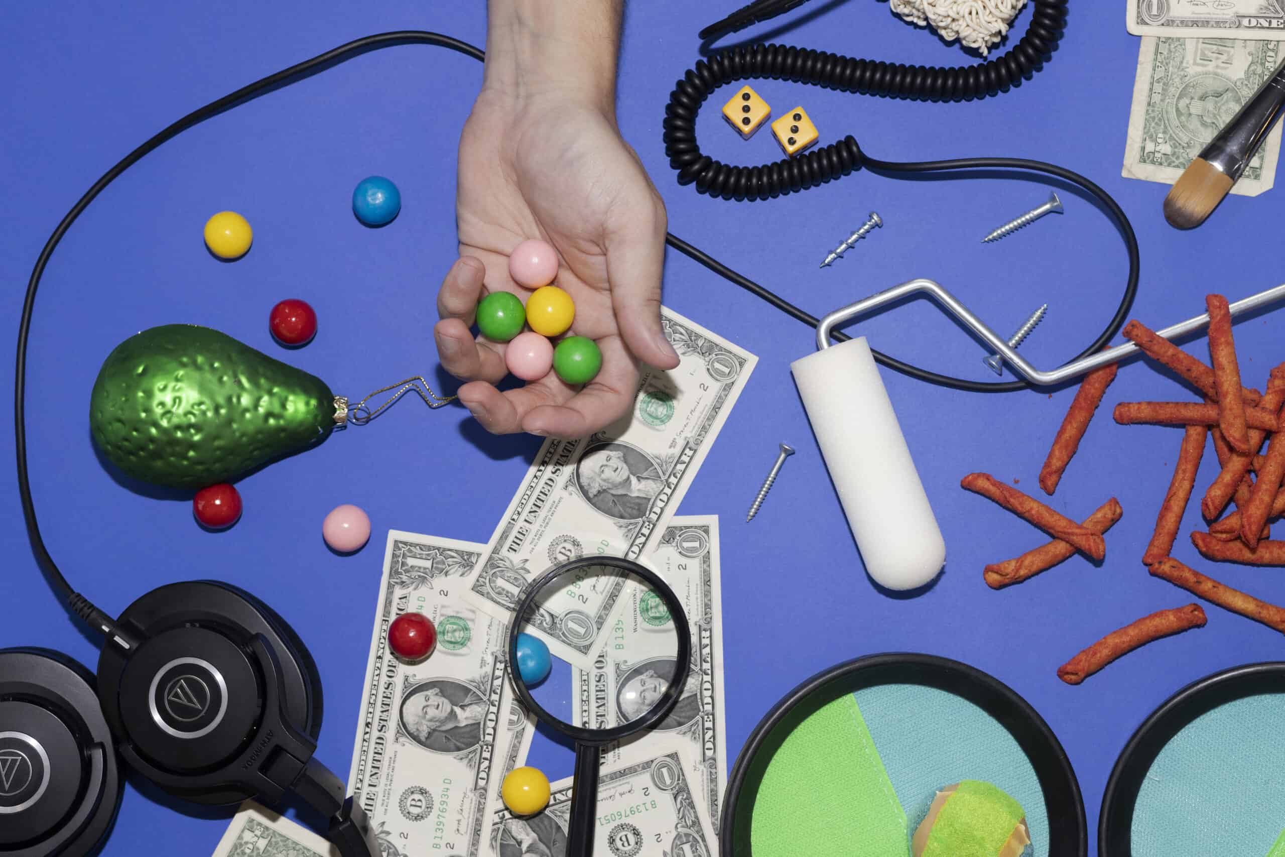 A photo of a creator handing out candy, representing a list of the best lead magnet tools.